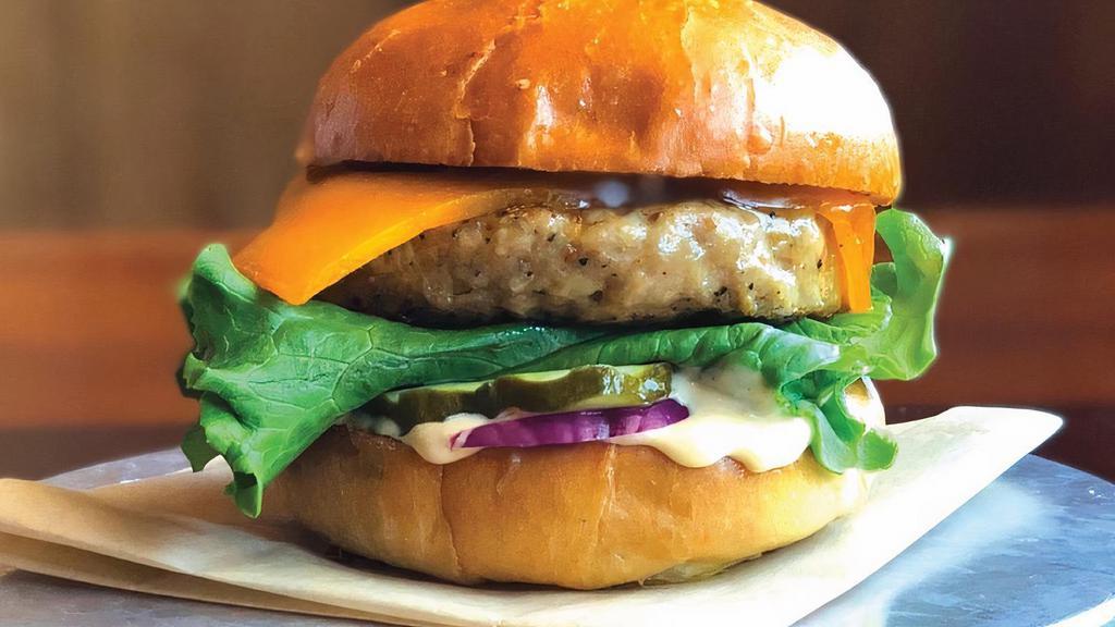 Chicken Burger · chipotle seasoned chicken thigh custom ground by SP Provisions, tillamook Cheddar, leaf lettuce, pickle, red onion, and our tangy chick-sauce
