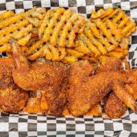 Smoked Chicken Wings · 4 wings served with waffle fries. Your choice of our premium dry rub, Parmesan garlic, or to...