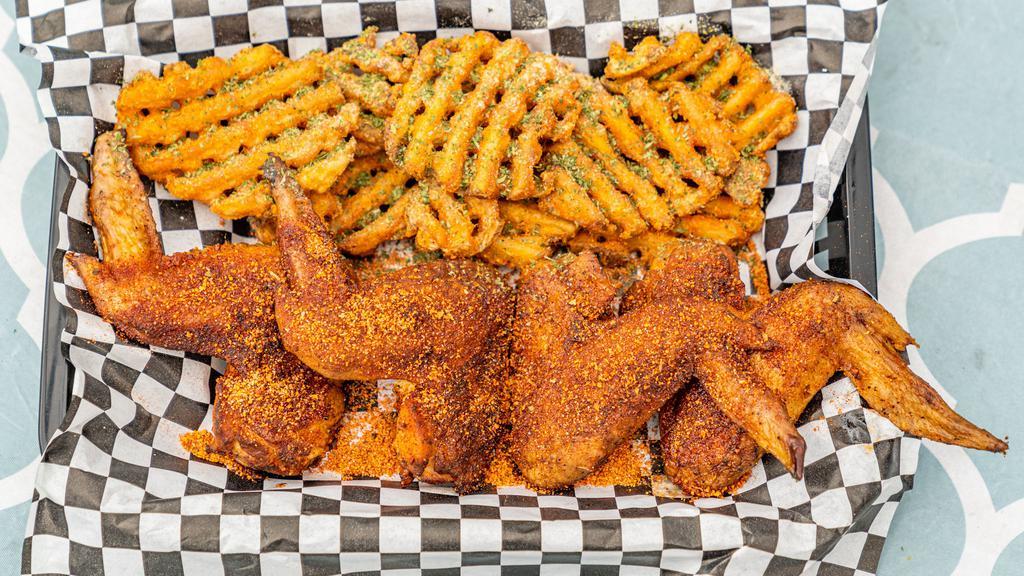 Smoked Chicken Wings · 4 wings served with waffle fries. Your choice of our premium dry rub, Parmesan garlic, or tossed in our homemade BBQ sauce.