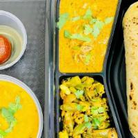 Roti Thali (Veg ) - All Day (Lunch & Dinner) · Includes - 4 Roti's (Indian plain Bread), 2 - Veg curries of the day, Dal or Sambar as avail...