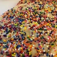 Sprinkle Sugar · Soft baked sugar cookie dough coated in sprinkles.