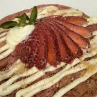 Strawberry Dreams · Strawberry Cookie Filled with Creamy Cheesecake  Topped  Vanilla Drizzle, Slices of Fresh St...
