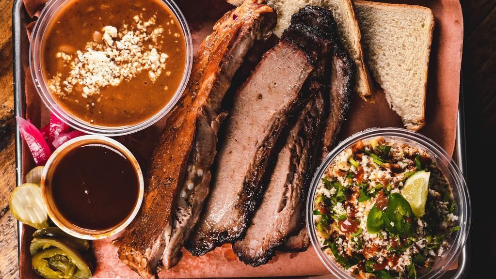 2 Meat Plate · Pork Ribs and Brisket pictured. 2 meats and 2 sides with Texas toast or fresh tortillas.