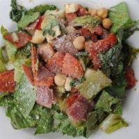 Delfino Chop Salad · Romaine with salami, pepperoni, provolone cheese, garbanzo beans, chopped tomato and our hou...