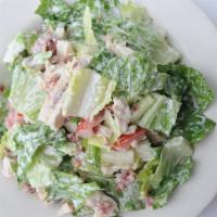 Chicken Blt Salad · Romaine topped with grilled chicken breast, bacon and chopped tomato tossed with our house-m...