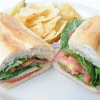 Italian Combo Sandwich · Salami, ham, pepperoni, provolone cheese, pepperoncinis, basil mayo, red onion, tomato and l...