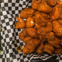 25 Boneless Wings · 25 boneless wings TOSSED IN  your choice of 2 sauces ONLY and choice of blue cheese OR ranch