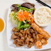 Com Tom Thit Nuong Cha Gio · Grilled shrimp pork with steamed rice and egg roll.