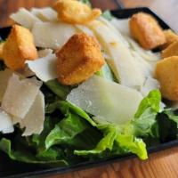 Caesar Salad · Crisp Romaine Lettuce, Parmesan Cheese, Croutons and Caesar Dressing.