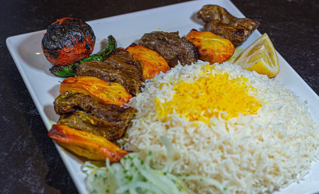 Mix Kebab (Chicken & Beef Shish Kabob) · Chicken breast and beef tenderloin marinated and skewered, then grilled served with basmati rice, grilled tomato, and onion.