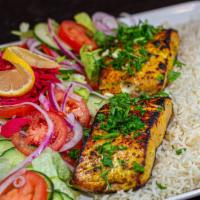 Salmon Kabob (Delicousness)  · Salmon coated in spices then charbroiled to cook. Served with basmati rice and onion.