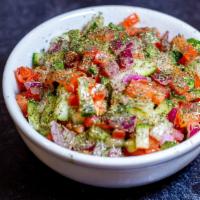 Shirazi Salad (Very Traditional)  · A traditional Persian salad consisting of cucumbers, onions, and tomatoes tossed in dried mi...