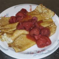Strawberry Swedes · Three rolled Swedish pancakes topped strawberry compote, powdered sugar, and whipped cream. ...