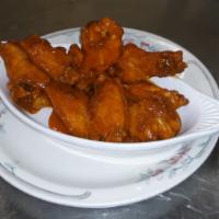 Buffalo Wings · 8 Crispy wings tossed in Frank's Red Hot sauce served with your choice of dressing