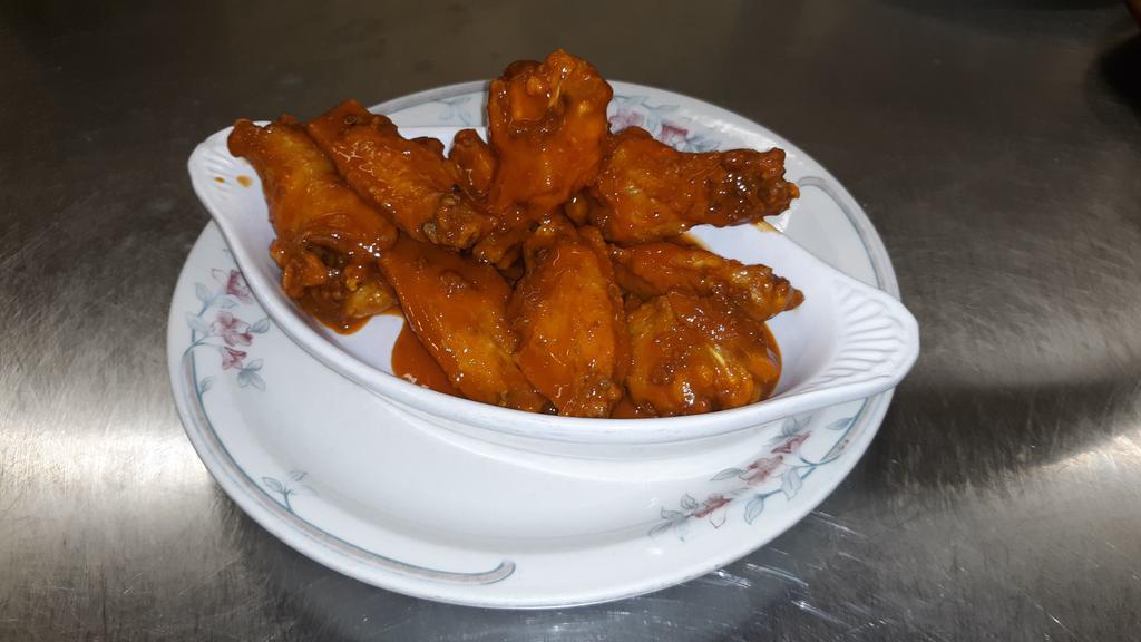 Buffalo Wings · 8 Crispy wings tossed in Frank's Red Hot sauce served with your choice of dressing