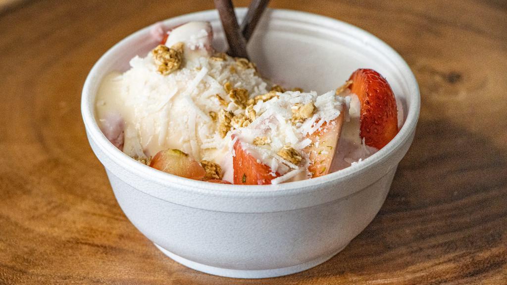 Strawberry Shortcake · Strawberry and vanilla ice cream topped with sweet cream, fresh strawberry, walnuts, cocoa shavings, and a strawberry baryta cookie.