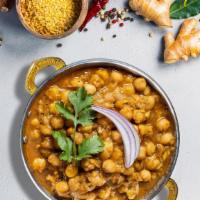 Chana Be With You (Chana Masala) · Chickpeas cooked in a tomato and onion gravy with Indian spices.