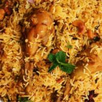 Chunky Chicken Biryani · Juicy chicken breasts cooked with Indian spices and basmati rice. Served with house raita.