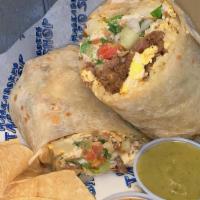 Breakfast Burrito · Breakfast burrito is cooked on the grill with potatoes, green peppers, onions, a little pico...