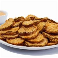 Fried Pickles · Lightly breaded sliced pickles served with our tangy dipping sauce. 1180 cal.