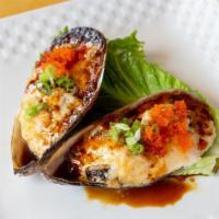 Baked Green Leaf Mussels · 2 pieces. Green mussels green onion, masago cream sauce and sweet sauce.