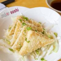 Agedashi Tofu · 4 pieces deep-fried tofu with bonito flakes, green onion and tempura sauce.