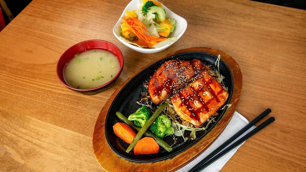 Salmon Teriyaki · Grilled salmon, steamed vegetables, scallion, and sesame seeds with teriyaki sauce. Served with mio salad.