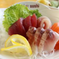 Sashimi Combo · Three pieces tuna, three pieces yellowtail, three pieces salmon. Served with steamed rice. C...