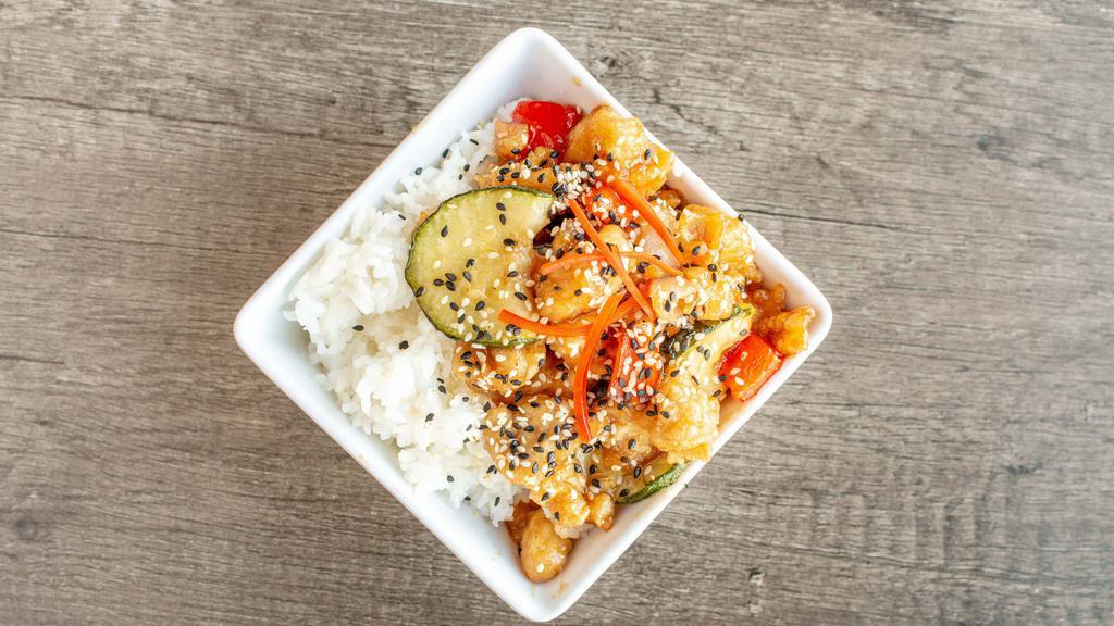 Sesame Chicken Bowl · Crispy chicken with bell peppers, Zucchini and onions served in a tangy sesame sauce!