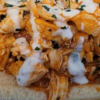 Buffalo Chicken Dog · All beef hot dog topped with  our signature buffalo chicken, & ranch dressing