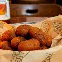 Scooby Snacks · Mini corn dogs served with yellow mustard.