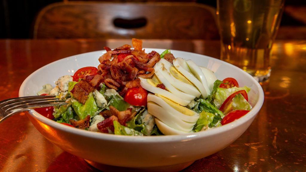 Blue Bayou · Romaine, bacon, chopped egg, blue cheese crumbles, tomato, and blue cheese dressing.