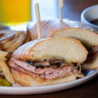 Portland Dip · turkey, grilled mushrooms, Swiss cheese, & Secret Sauce on a roll with garlic jus for dipping.