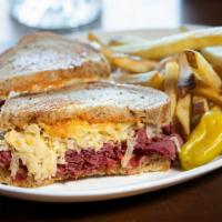 Reuben Kincaid · hot pastrami, swiss cheese, sauerkraut, 1000 island on grilled rye bread served with tots