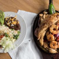 Fajitas Mixtas · Mixed fajitas. Fish, chicken, beef and shrimp mixed with bell peppers, salsas and onions. Fa...