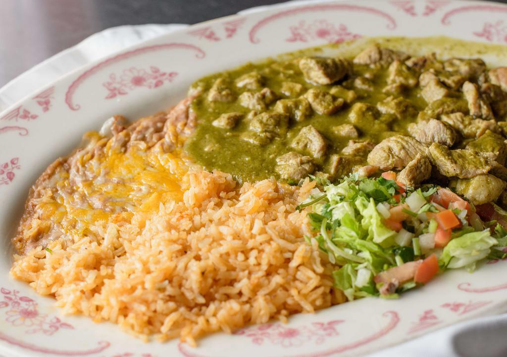 #1. Chile Verde · Chunks of slow simmered pork in a flavorful tomatillo sauce, careful, sometimes spicy. Served with rice and beans.