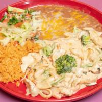 #18. Pollo A La Crema · Sliced boneless chicken breast simmered in our special cream sauce with onions, carrots mush...