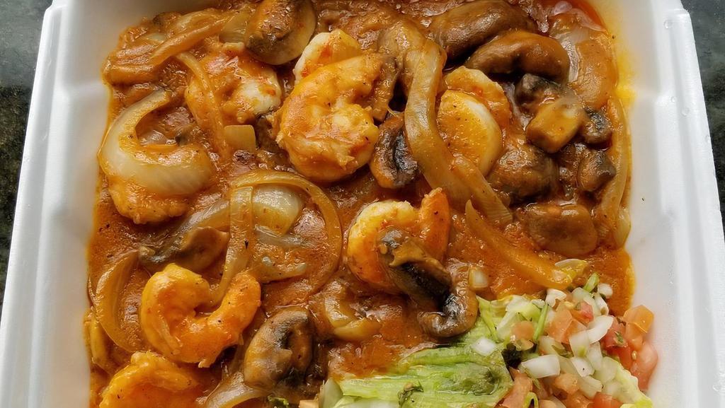 Arroz Con Camarones · Tiger. Shrimps sauteed with onions, mushrooms and served on a bed of rice. Topped with jack cheese and a side of tortillas.