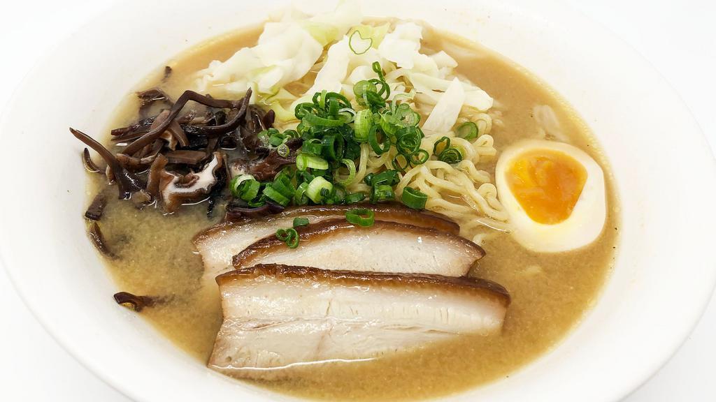 Miso Ramen · Popular item. Bean paste base, served with two half soft-boiled egg, chashu (pork belly or loin), wood-ear mushroom, cabbage, and green onions.