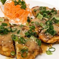 Japanese Pancake (Okonomiyaki) · Wheat flour and egg battered with cabbage, sweet potato, green onion and white onion. Served...