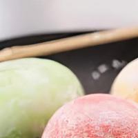 Mochi Ice Cream · Ice cream wrapped in sticky rice dough. Served in assorted flavors including mango, green te...