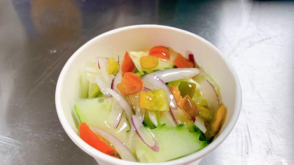 Cucumber Salad · Fresh thick sliced cucumber, red onion, and pepper mix with Thai style sweet vinaigrette dressing.