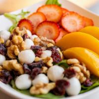 Summer Salad · Fresh crisp mixed greens with strawberries, peach, cranberries, walnuts and mozzarella pearl...