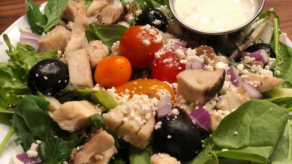 Mediterranean Salad · Fresh crisp mixed greens with cherry tomatoes, cucumber, grilled chicken, diced red onions, Kalamata olives, sunflower seeds and feta cheese, includes choice of  dressing.