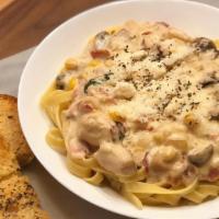 Venezia Pasta · Choice your pasta, topped with grilled chicken, bacon, sweet corn, mushroom sauce and grated...