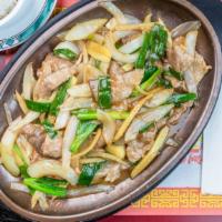 Beef With Ginger & Scallions · Served on a sizzling hot plate.