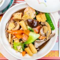 Triple Hot Pot (Served In Hot Pot) · Chicken, beef, shrimp, fried bean curd & black mushrooms in our chef's special sauce
