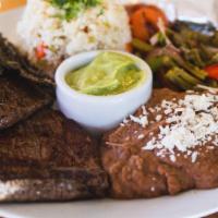 Asada Plate · Thinly sliced flank steak, pork chorizo, rice, beans, guacamole, cactus salad and heirloom c...