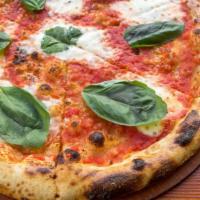 Margherita Pizza · Tomato sauce, house pulled mozzarella and basil.