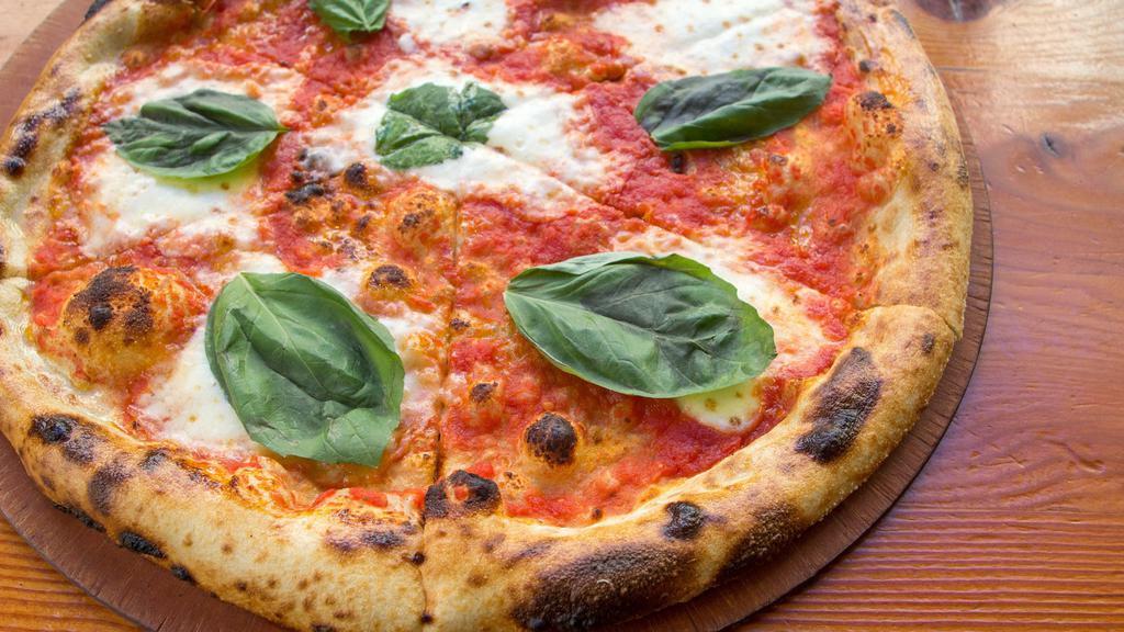 Margherita Pizza · Tomato sauce, house pulled mozzarella and basil.